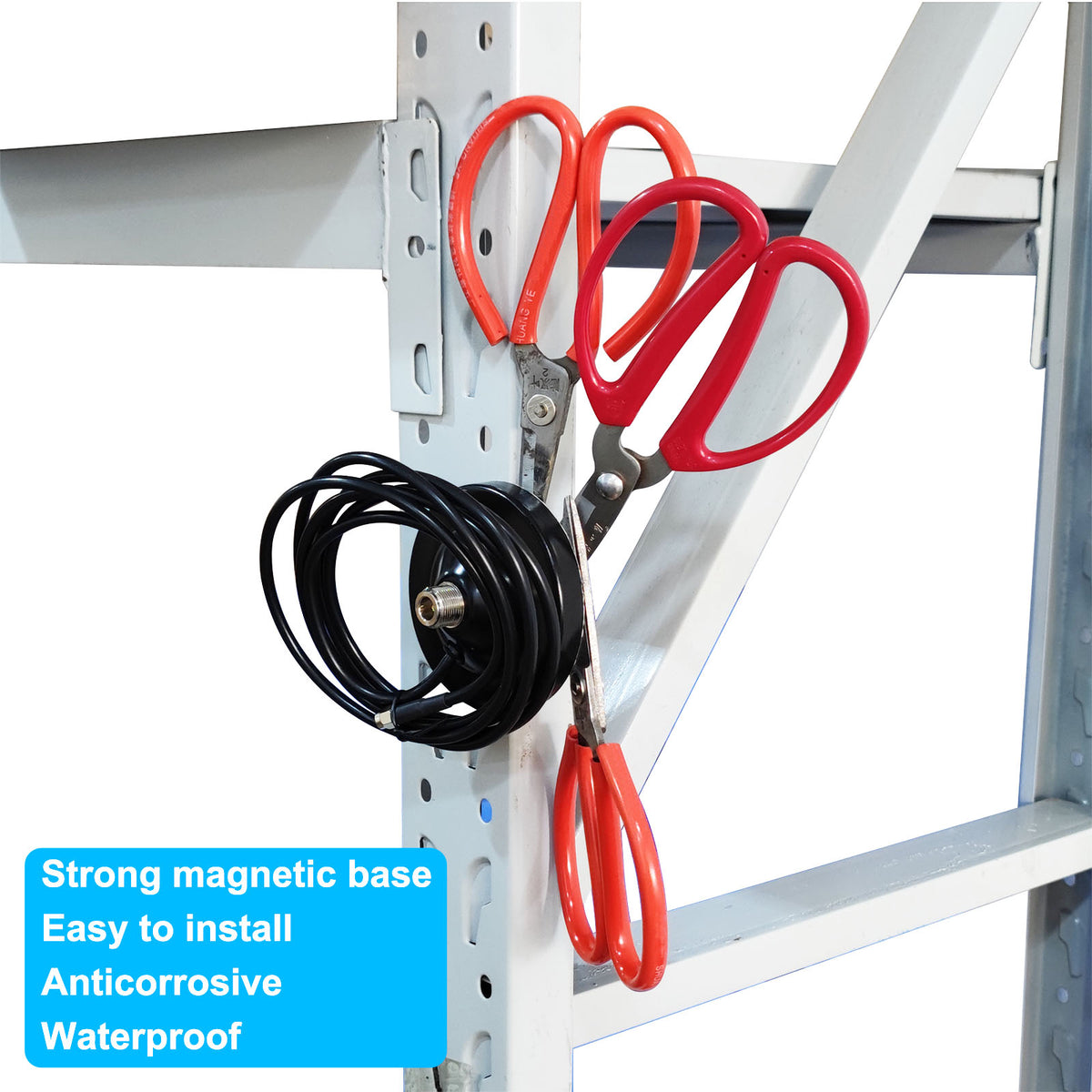 Black magnetic antenna base and coaxial cable arranged on an outdoor metal support frame