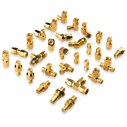Assorted gold-tone SMA and RP-SMA coax adapters in straight, angled, bulkhead and T-shaped styles