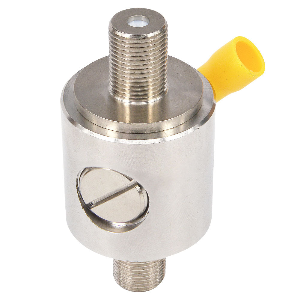 Upright silver coaxial surge protector with female threaded ends and yellow-capped ground lug