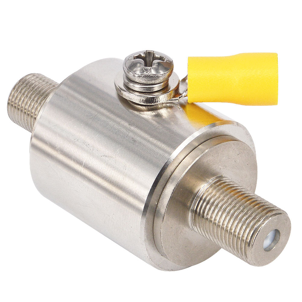 Angled view of a cylindrical silver RF surge protector with threaded ends and yellow-capped ground lug